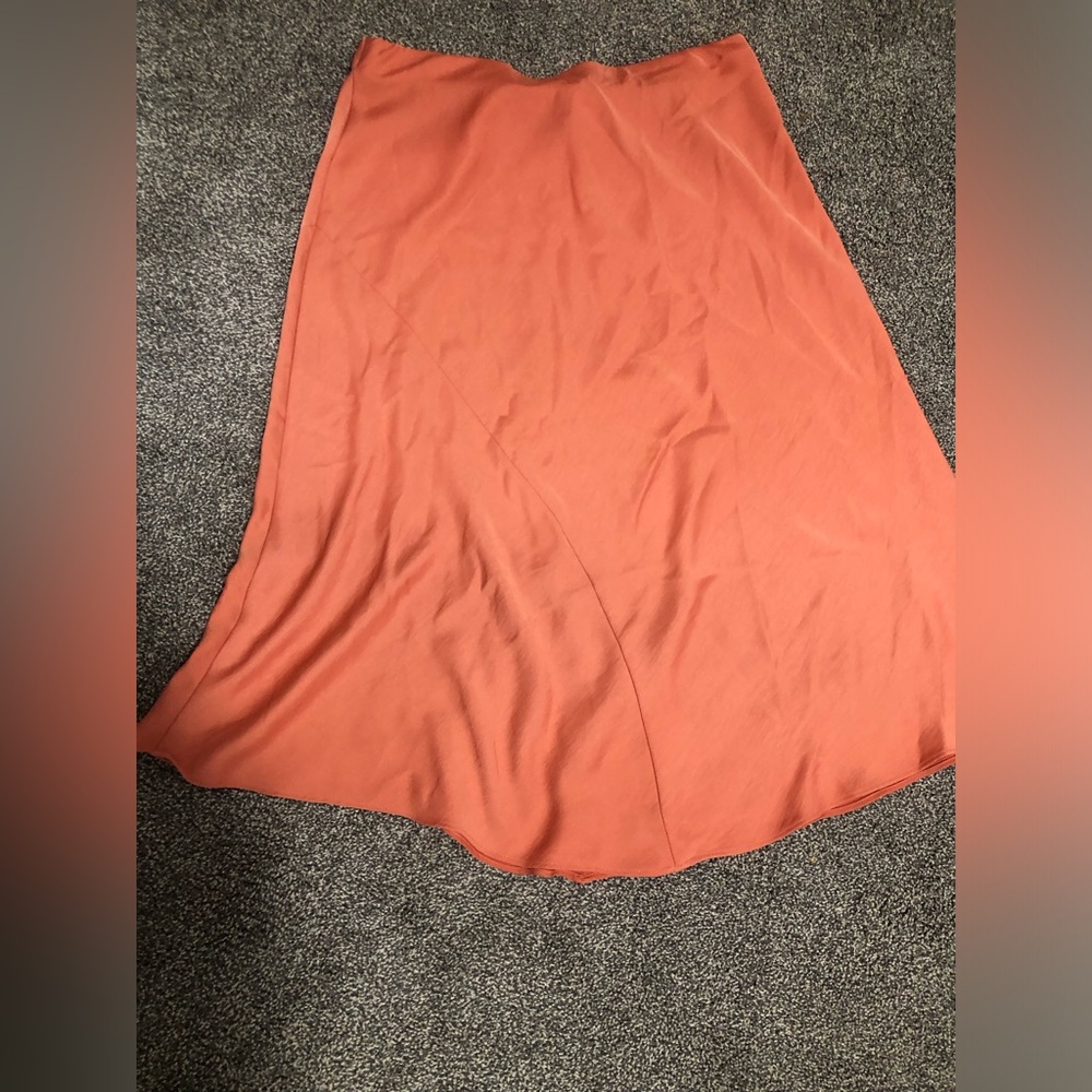 A new day long orange skirt.